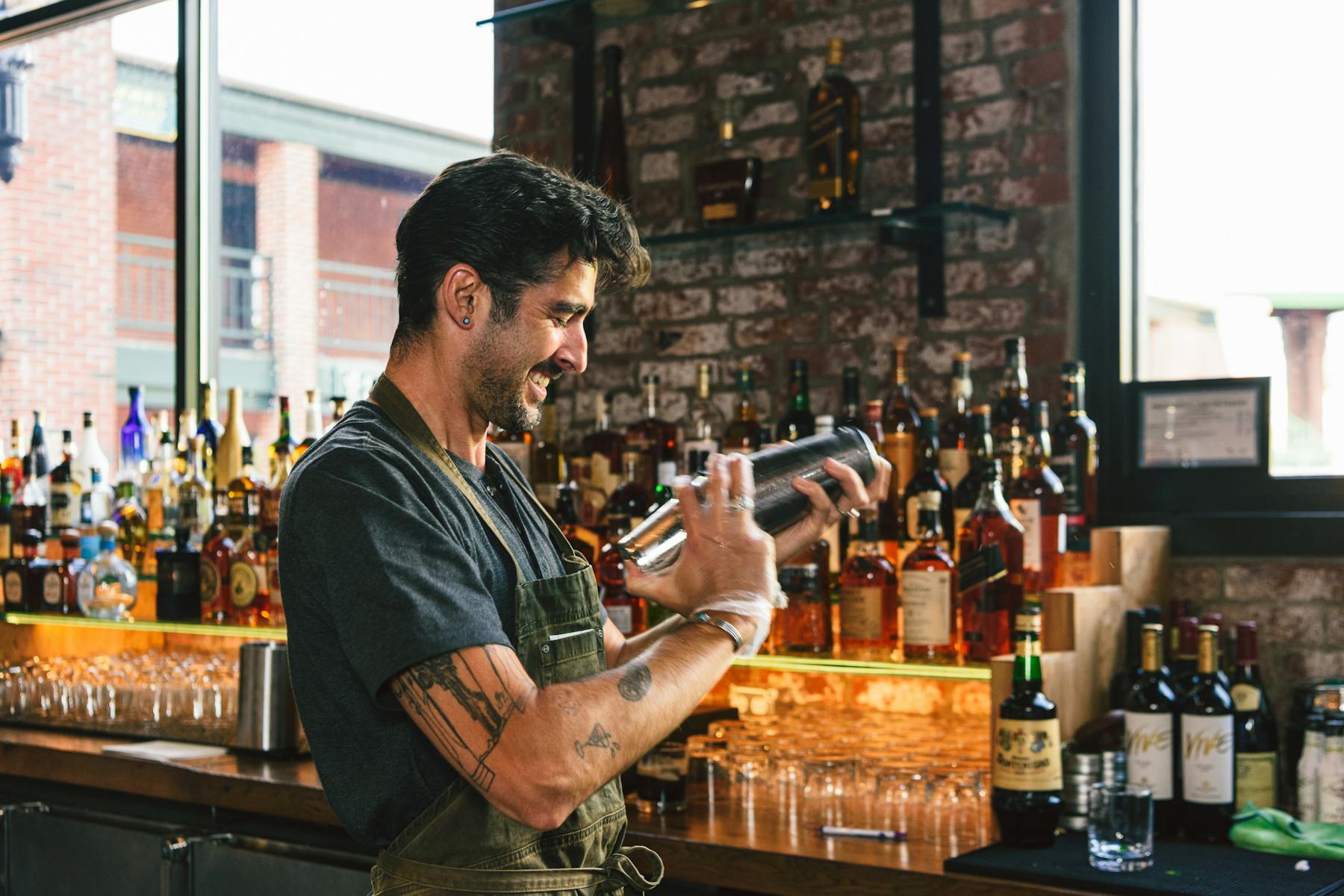 a man holding a bottle of wine