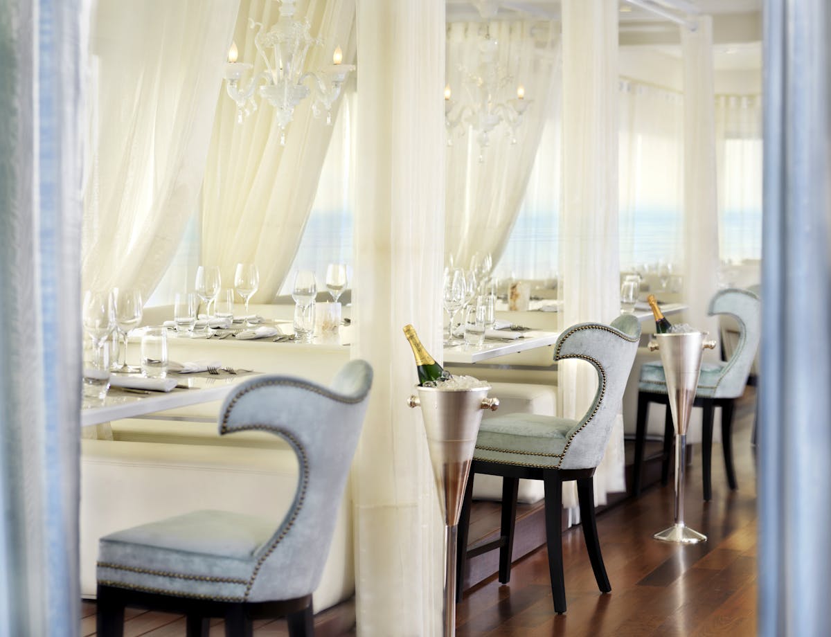 a dining room table in front of a window